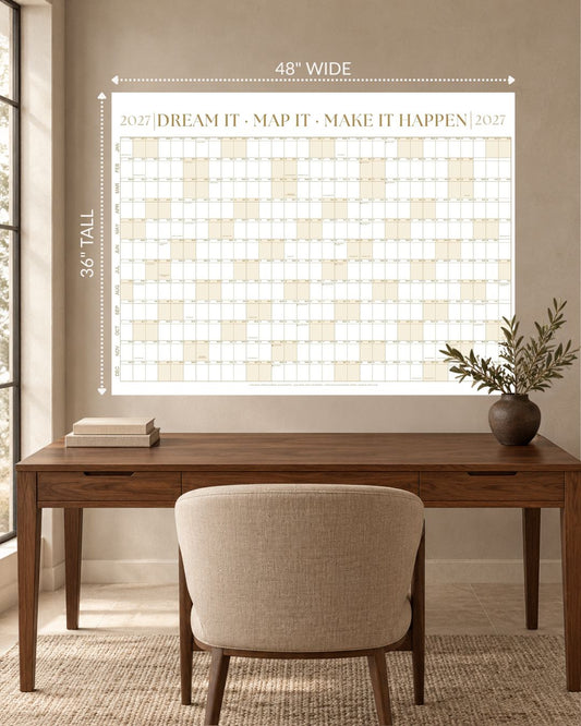 2027 Signature Wall Calendar Kit in Sandstone Gold, 48 x 36 inches, above a desk